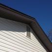 Dark Brown soffit/ fascia, dutch lap vinyl siding and vinyl louver vent.
