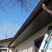 Dark brown soffit/ fascia and gutters.