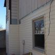 Vinyl siding Tan tharmal windows, job in progress.